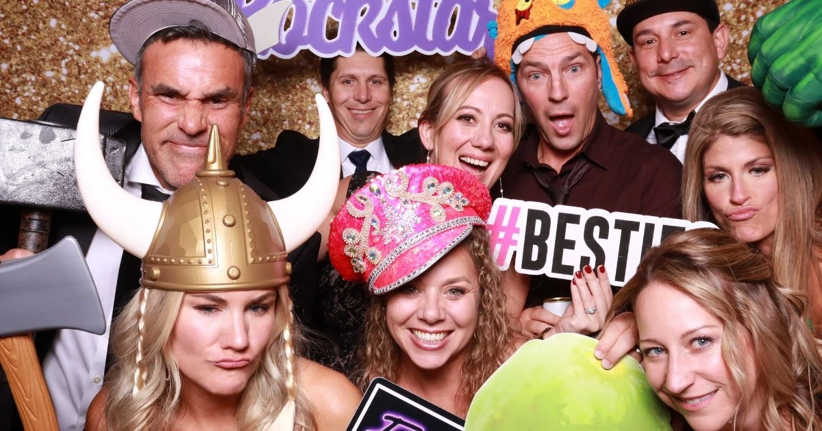 Guests posing in a Photo booth rental for a Corporate Gala in Fort Collins, Colorado