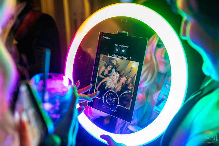 Mobile photo booth roamer providing on-the-spot photos at a Denver corporate event.
