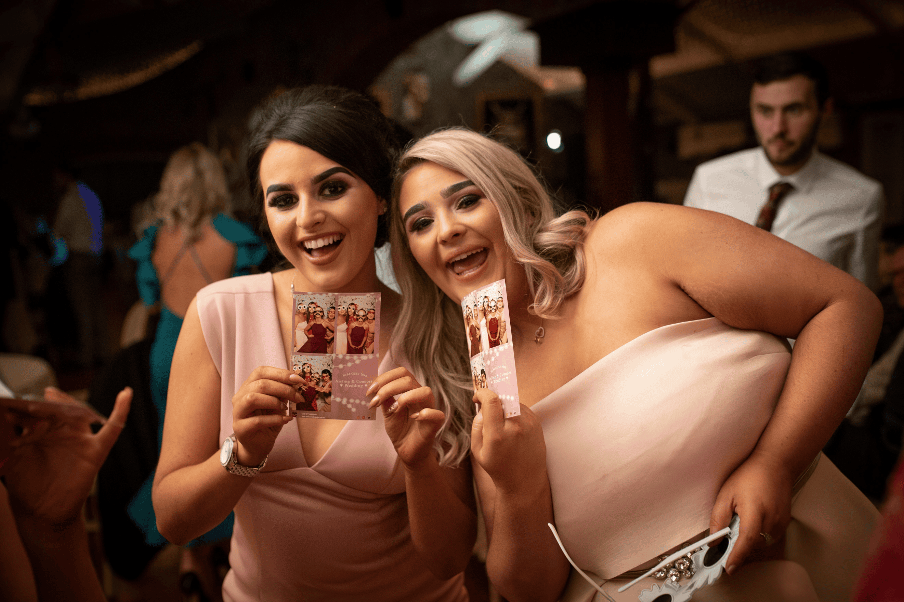 Guests laughing and taking photos during a private event in Windsor, CO