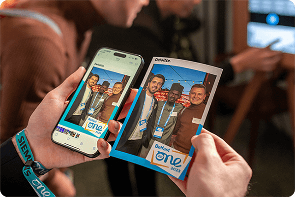 Trade show attendees using a branded photo booth in Fort Collins