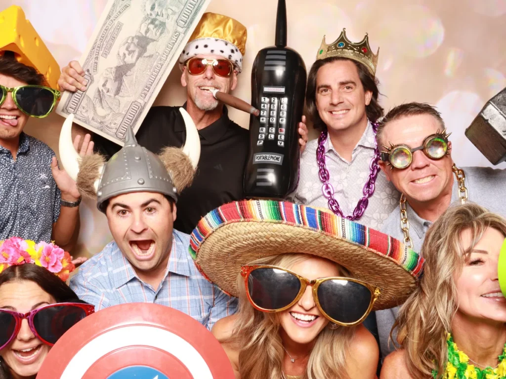 Guests posing with props and backdrop | CaptureME Photo Booth Rental Company in Windsor, CO | Weddings and Corporate Events in Northern Colorado