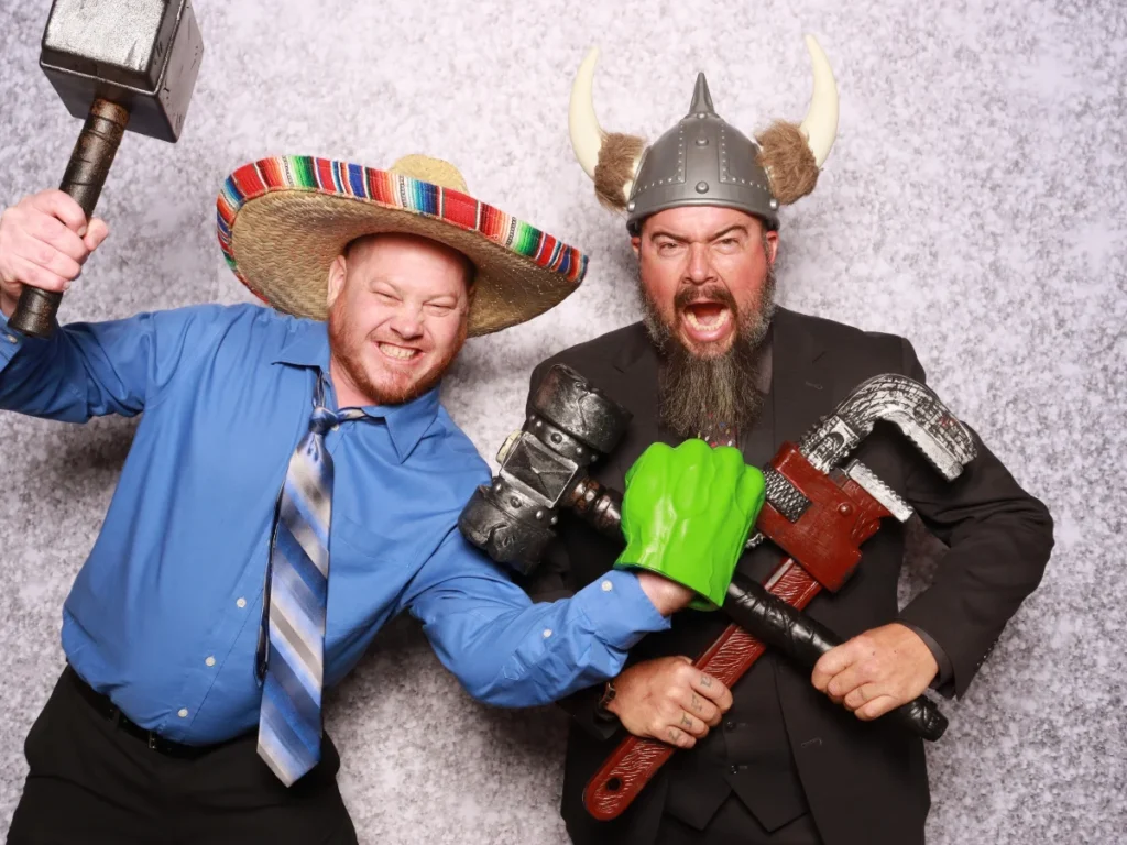 Guests posing with props and backdrop | CaptureME Photo Booth Rental Company in Windsor, CO | Weddings and Corporate Events in Northern Colorado