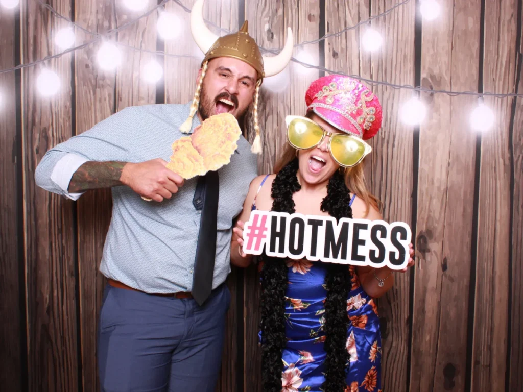 Guests posing with props and backdrop | CaptureME Photo Booth Rental Company in Windsor, CO | Weddings and Corporate Events in Northern Colorado