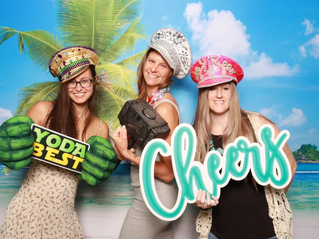 Guests posing with props and backdrop | CaptureME Photo Booth Rental Company in Windsor, CO | Weddings and Corporate Events in Northern Colorado