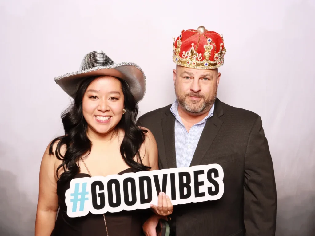 Guests posing with props and backdrop | CaptureME Photo Booth Rental Company in Windsor, CO | Weddings and Corporate Events in Northern Colorado