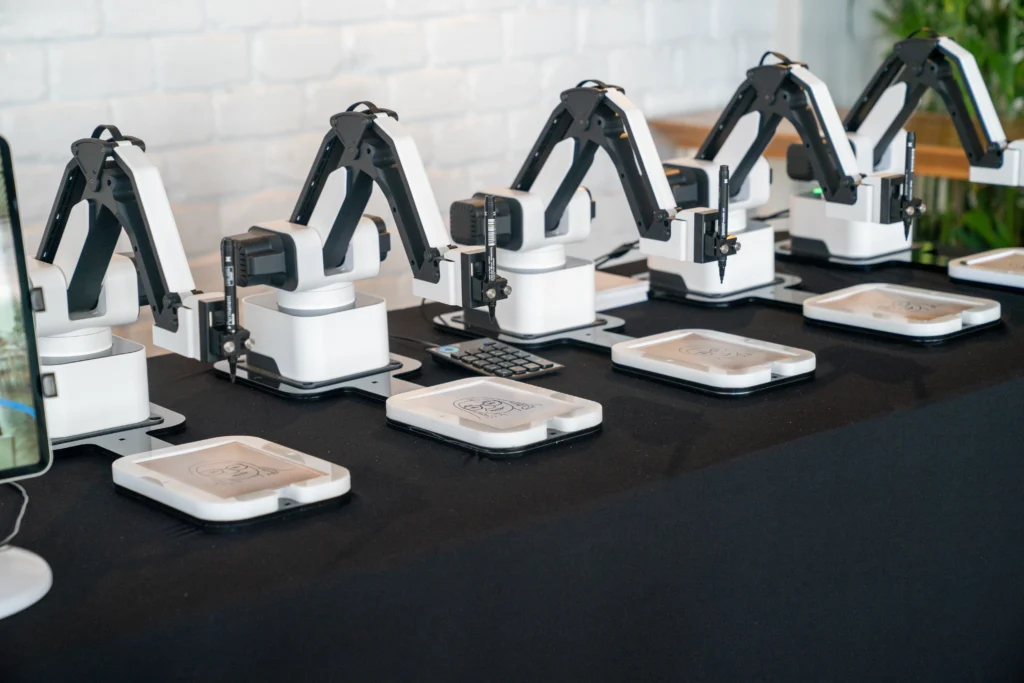 AI-powered sketch robot drawing a guest portrait live during an event